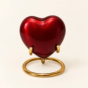 Amarisca™ mini urn in hartvorm, glanzend rood met goudkleurige standaard, op standaard